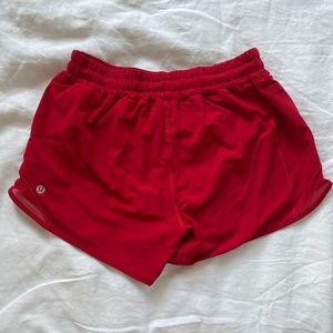 Lululemon Hotty Hot Shorts 4” inseam in red with mesh detailing on sides